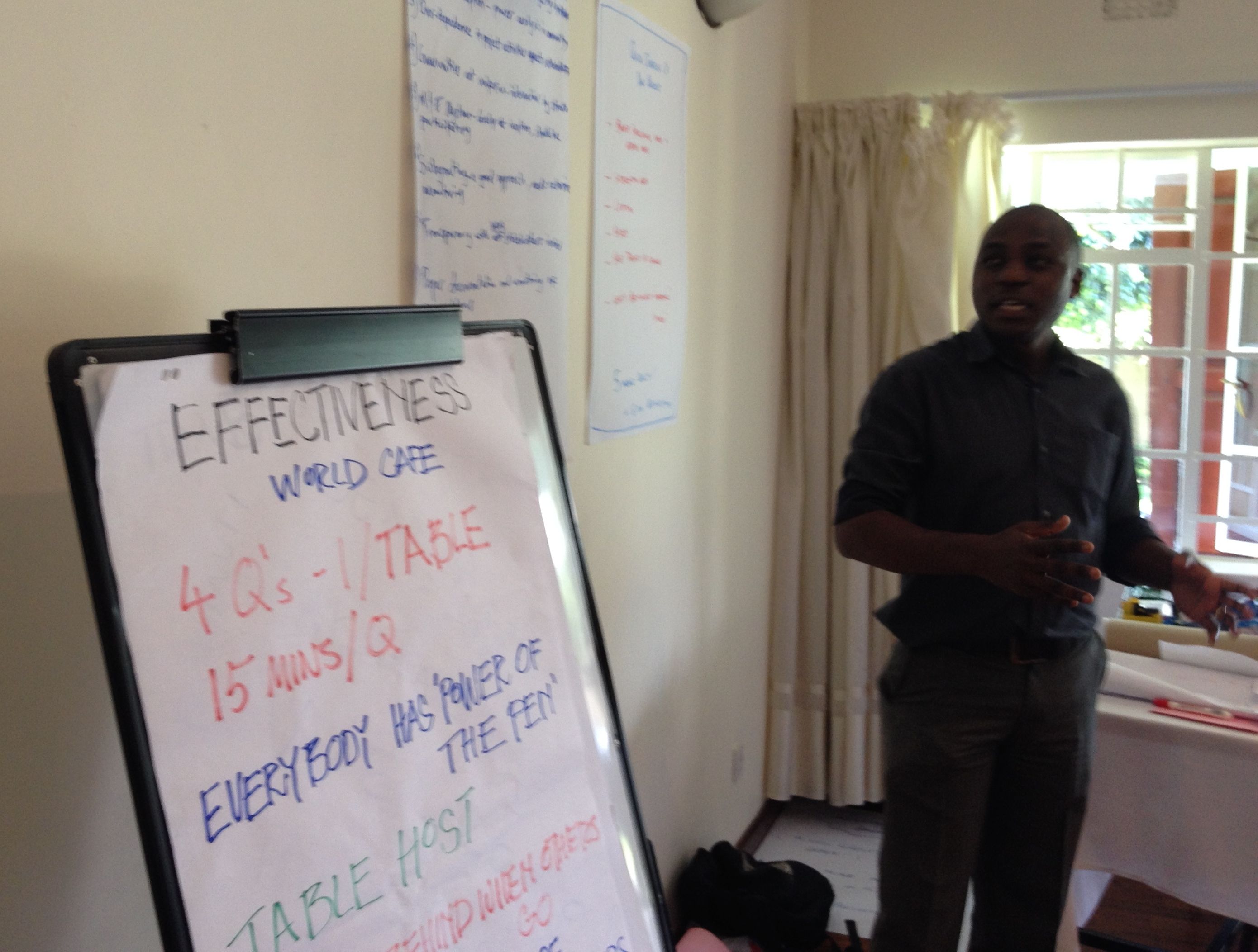 Tenthema (of the sugar out growers capacity building project) giving the discussion summary of the Effectiveness Successes World Cafe table.